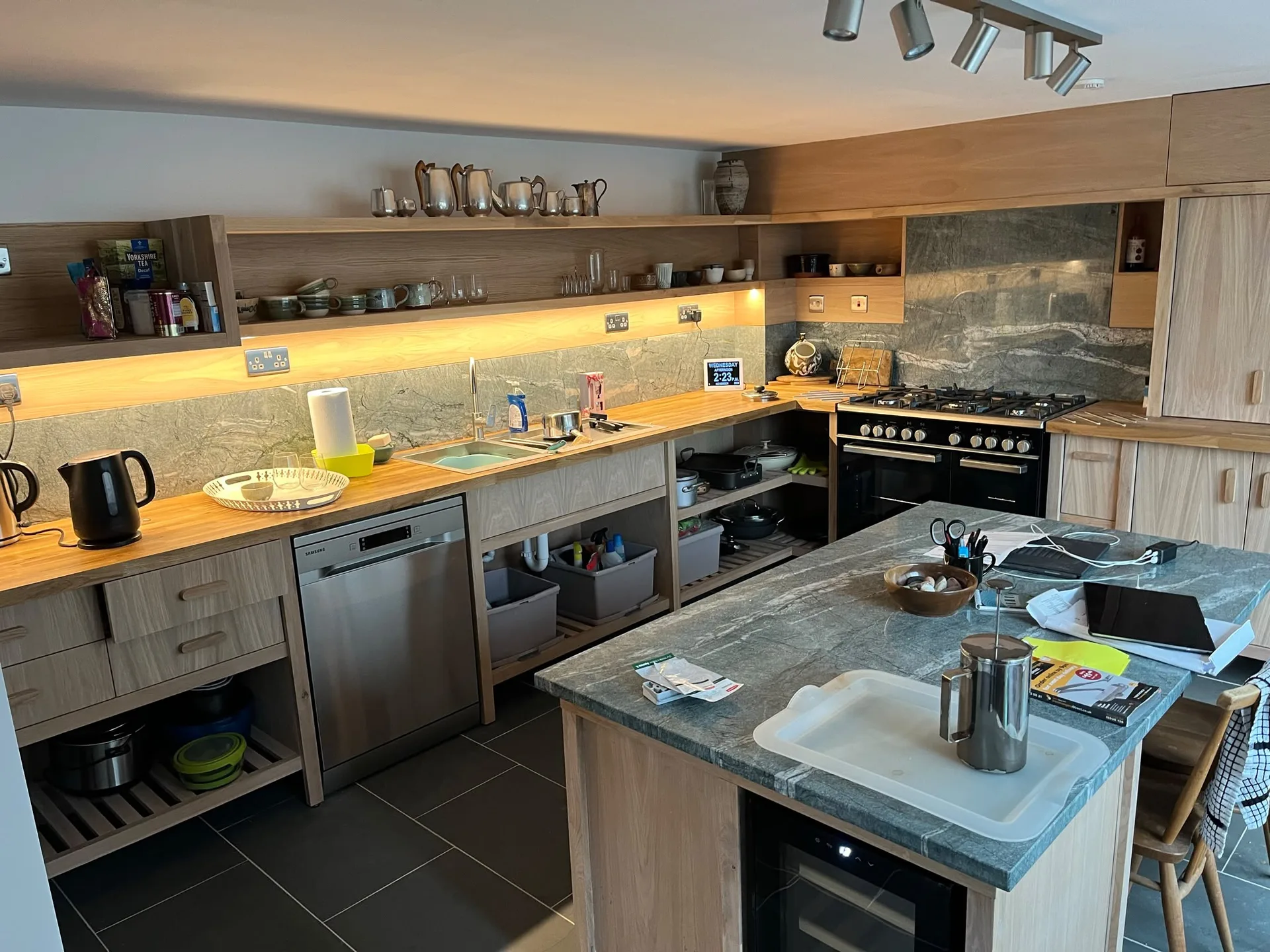 Modern kitchen with warm wood cabinetry and central island