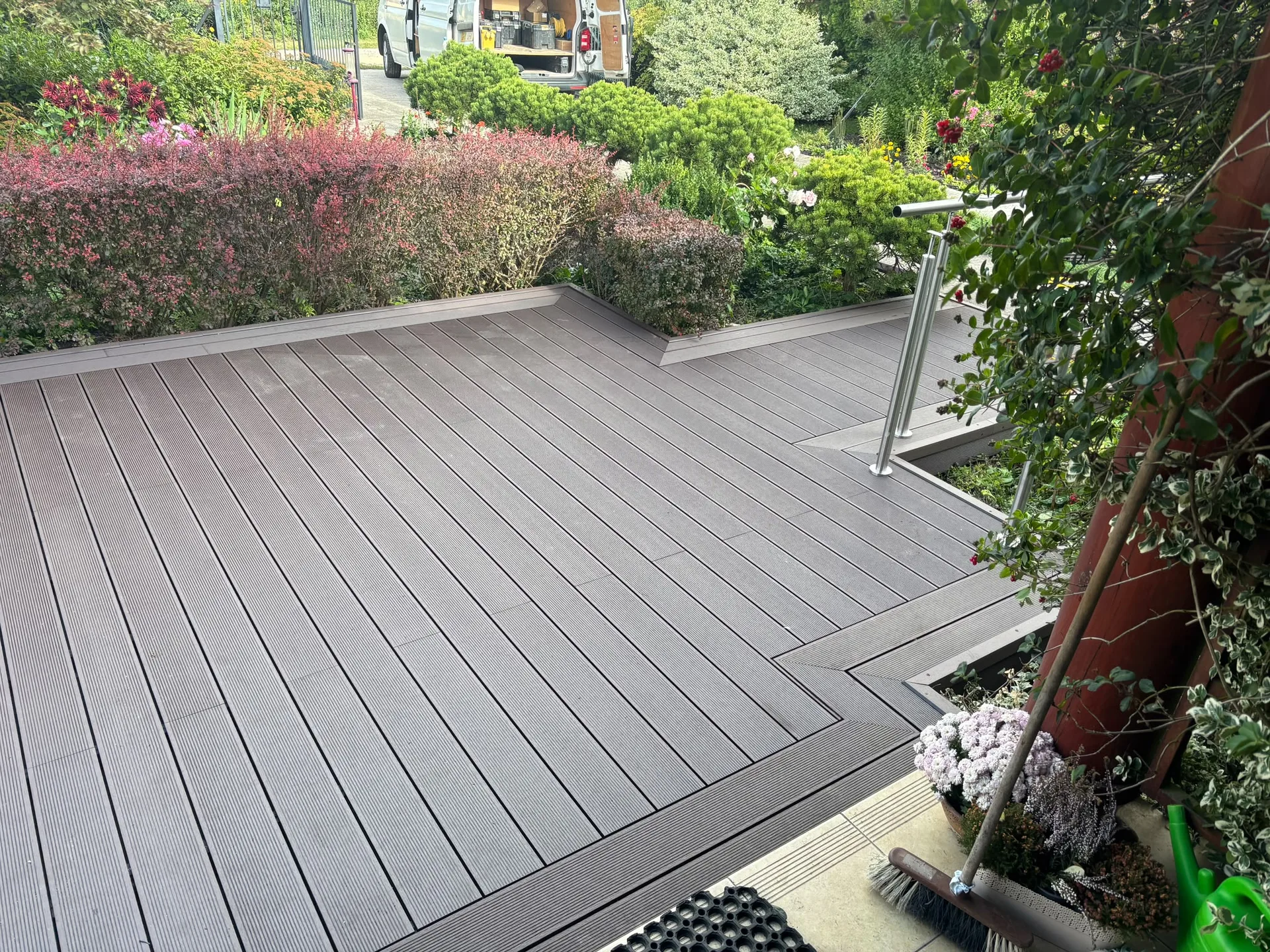 Modern composite deck with professional landscaping