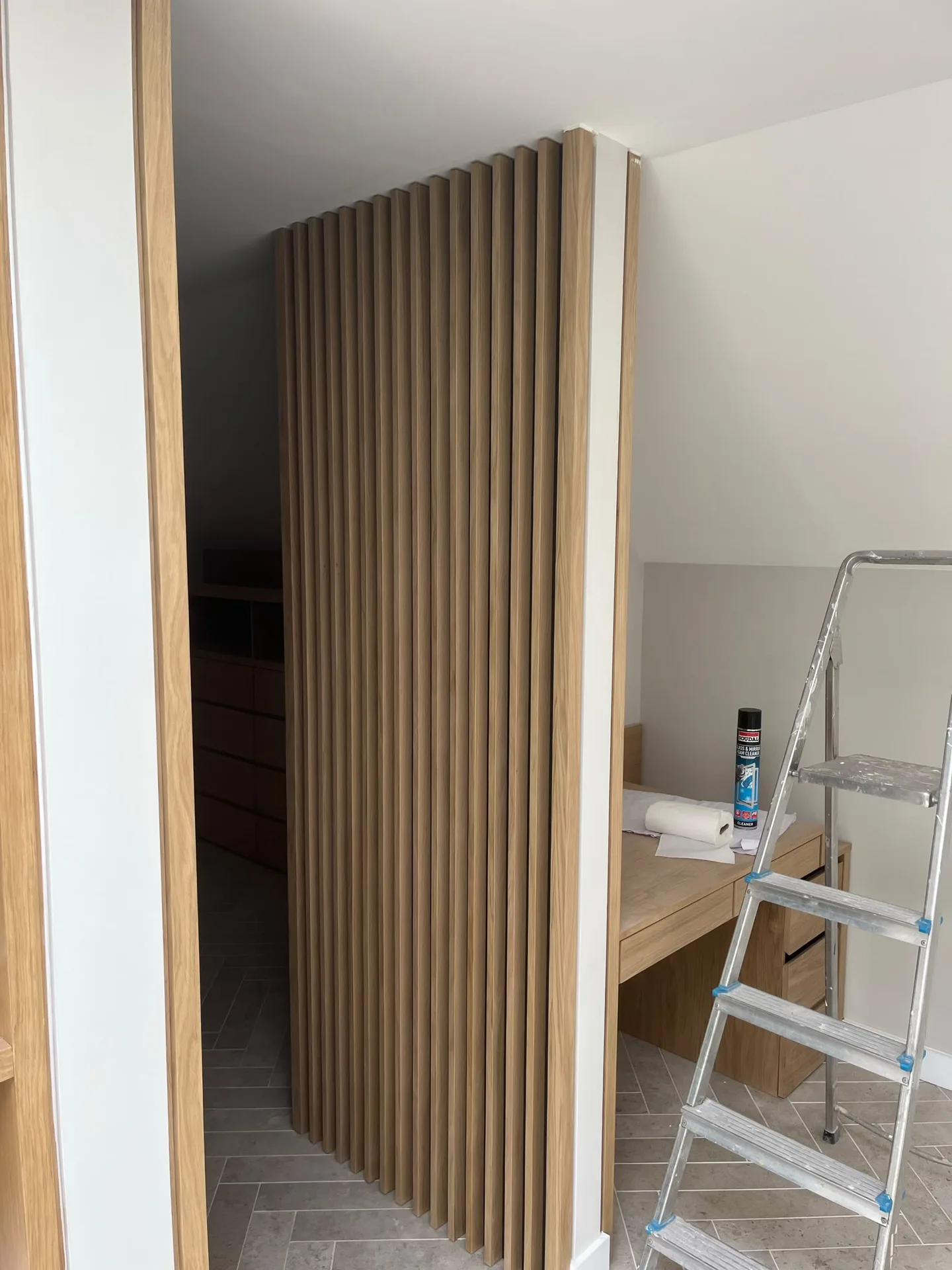 Modern wood slat wall paneling installation