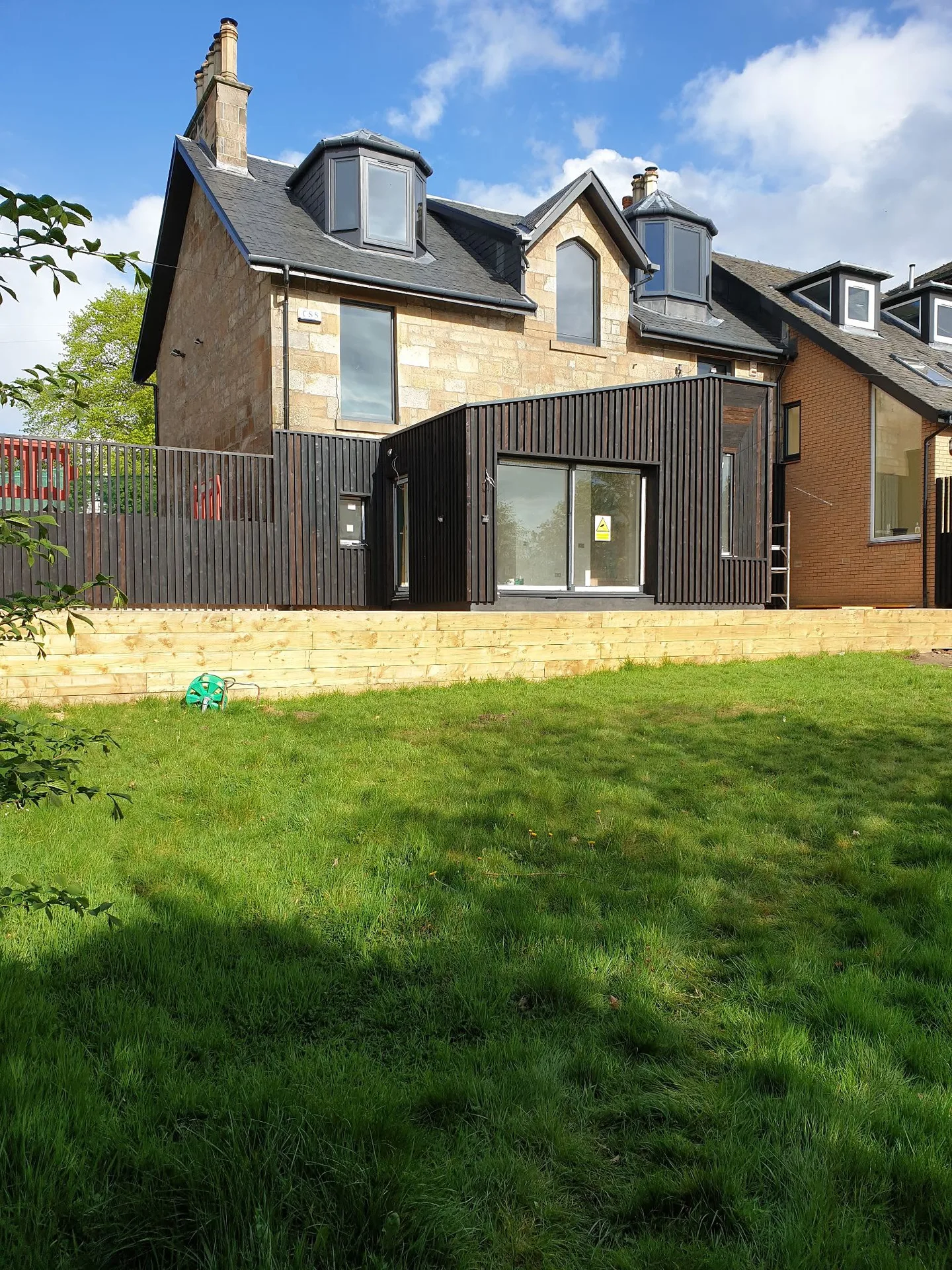 Modern home extension with stone and metal
