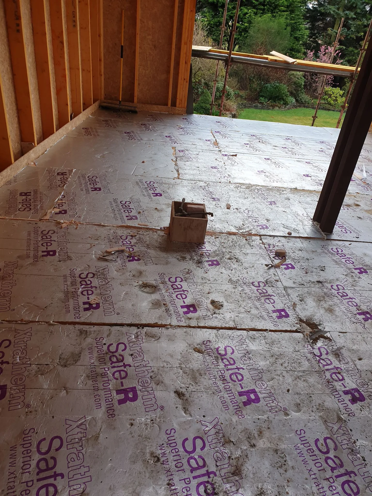 Wooden deck construction with concrete foundation base