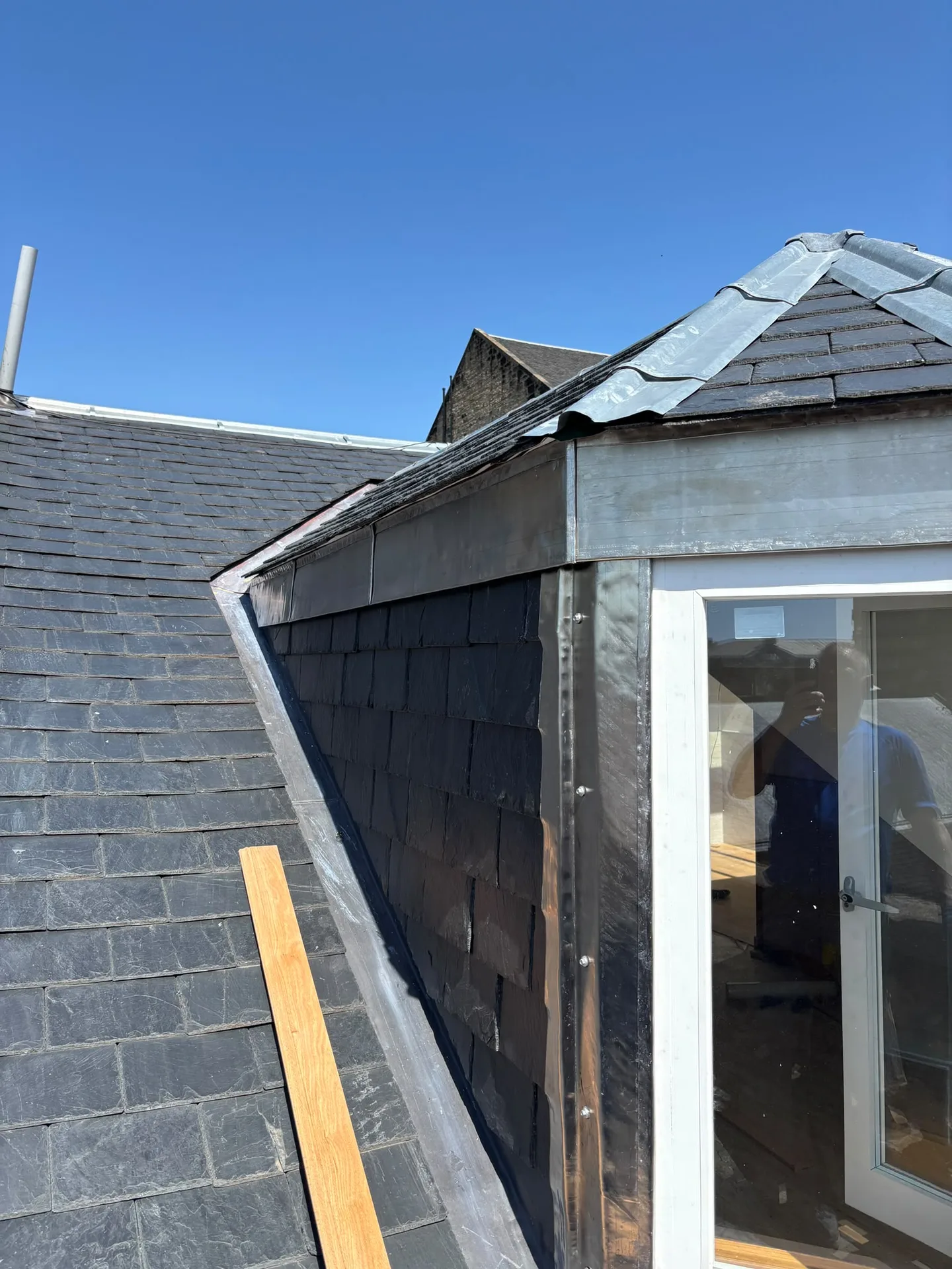 Modern residential roofing renovation with skylights