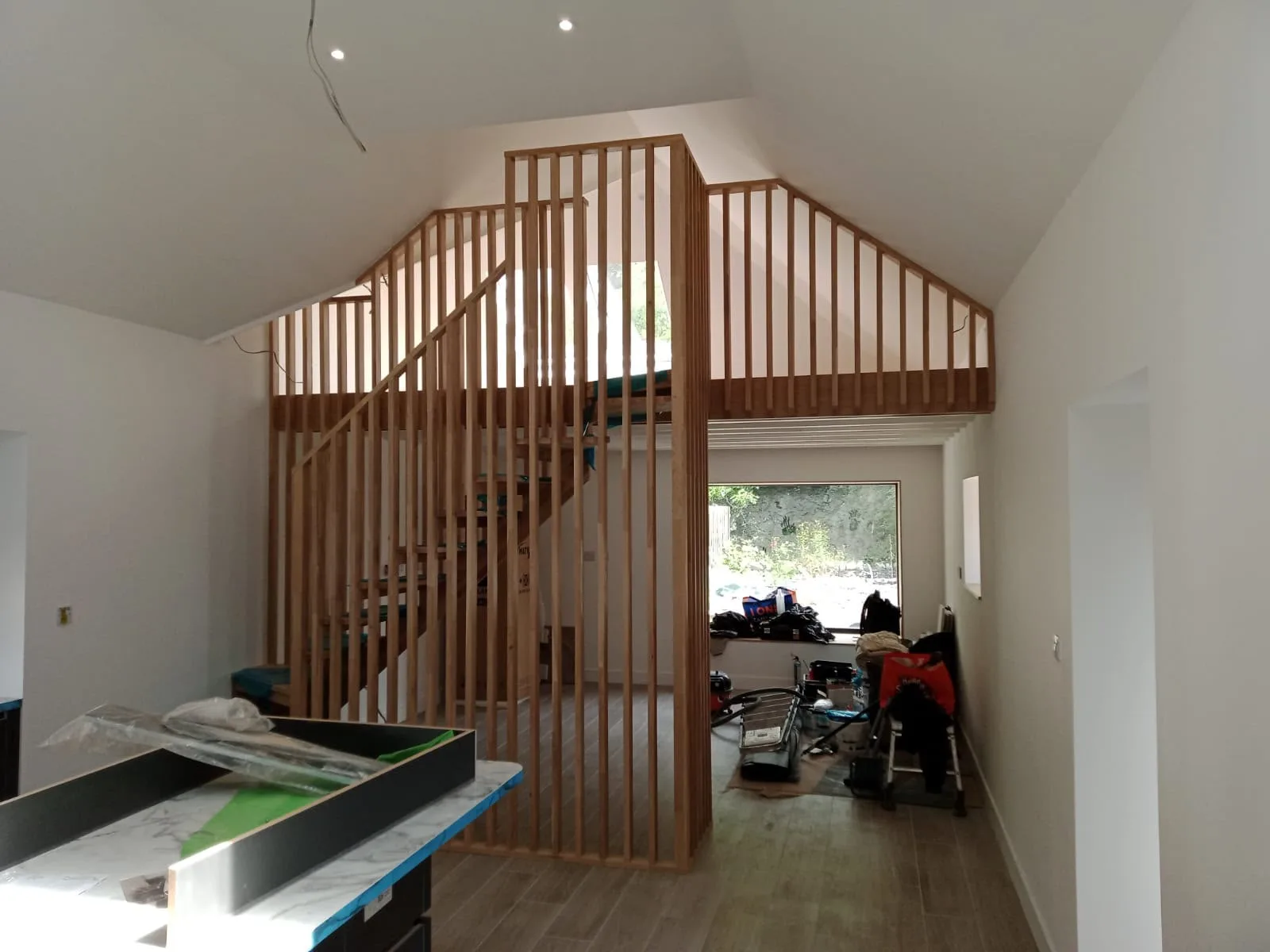 Contemporary wooden slat mezzanine partition