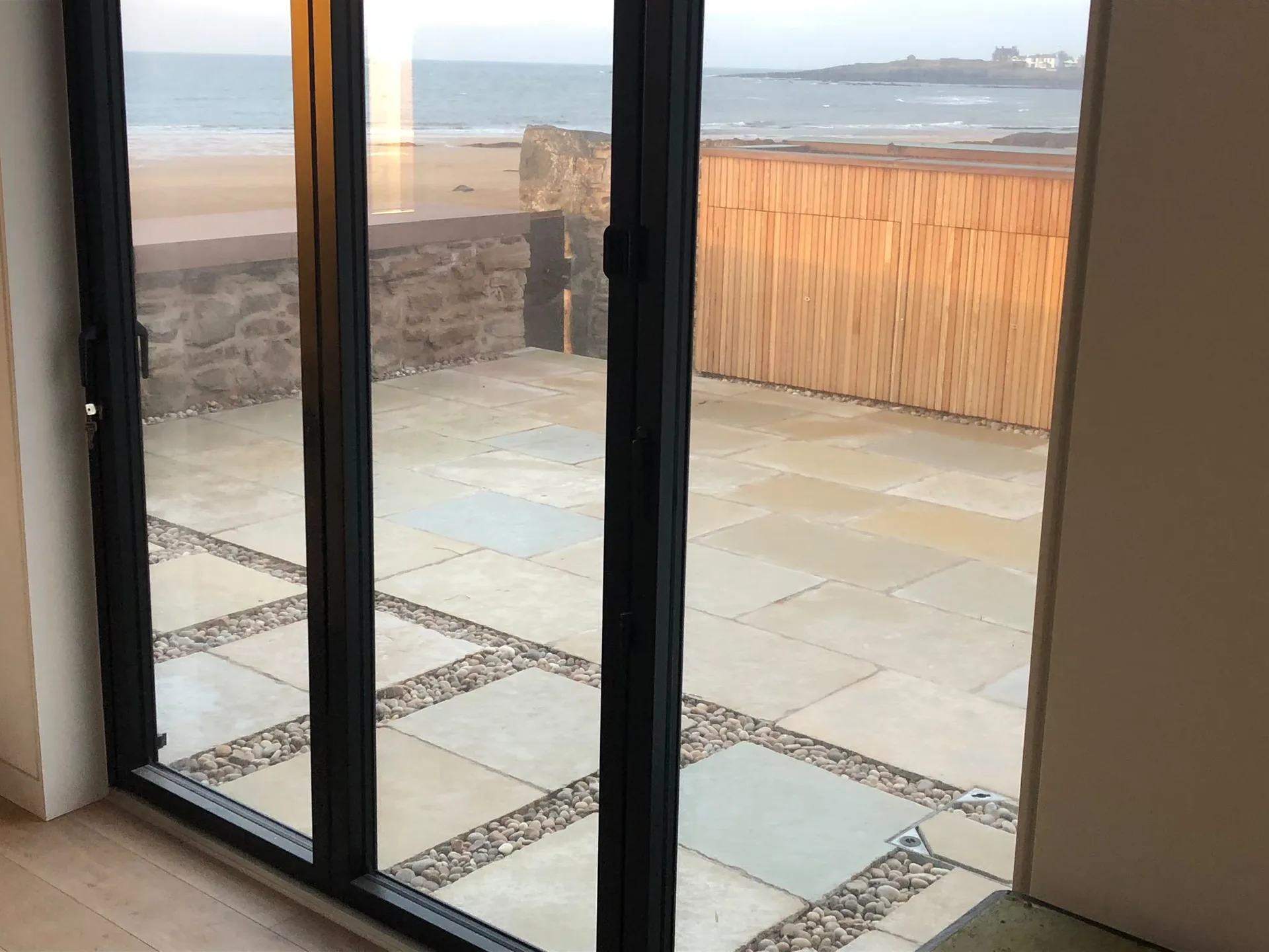 Coastal patio with ocean and cliff views