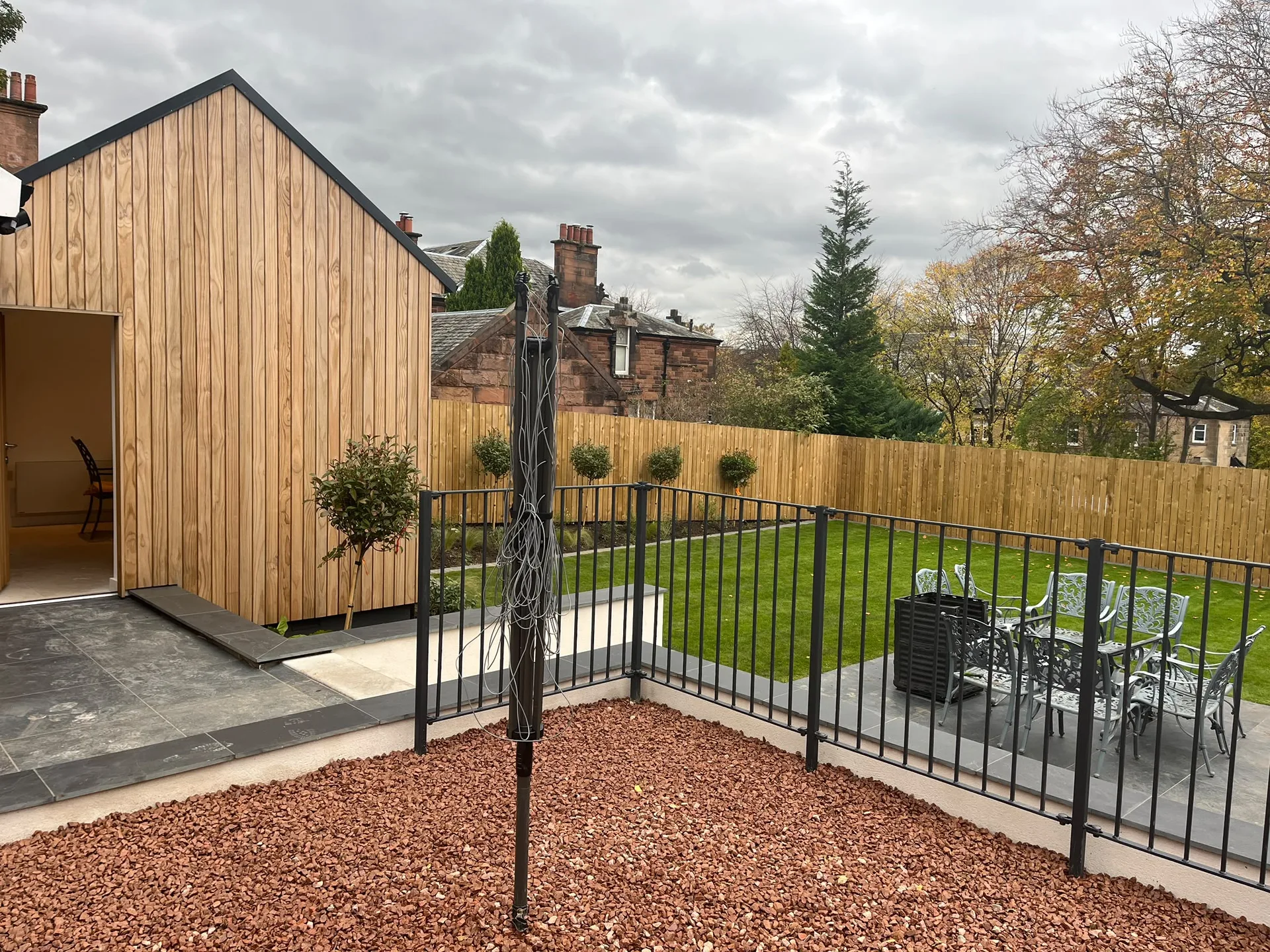 Modern timber extension with landscaped garden patio