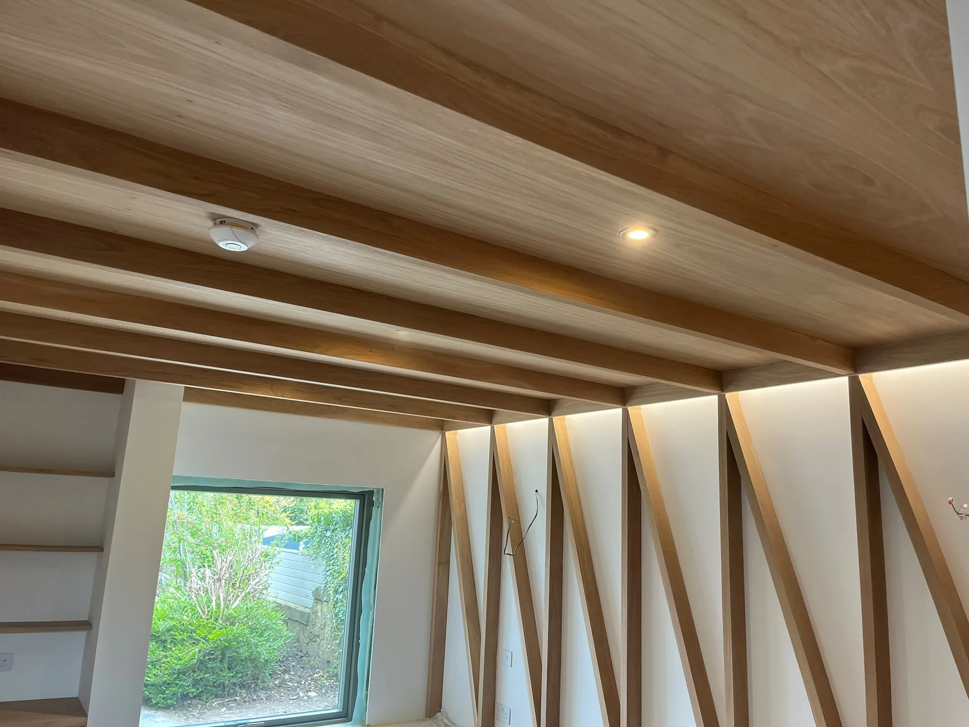 Modern interior with exposed wooden ceiling beams