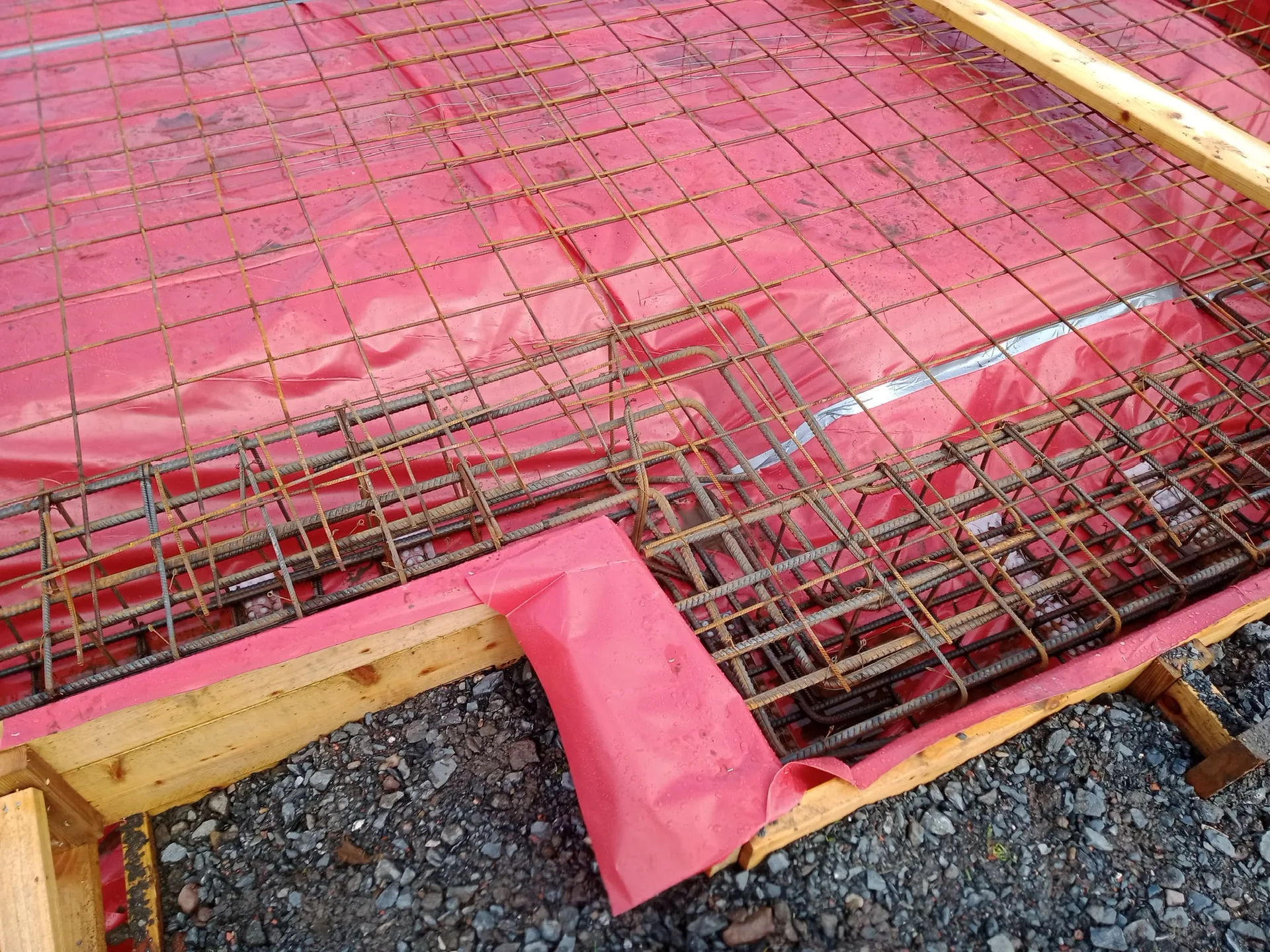 Foundation steel reinforcement framework covered