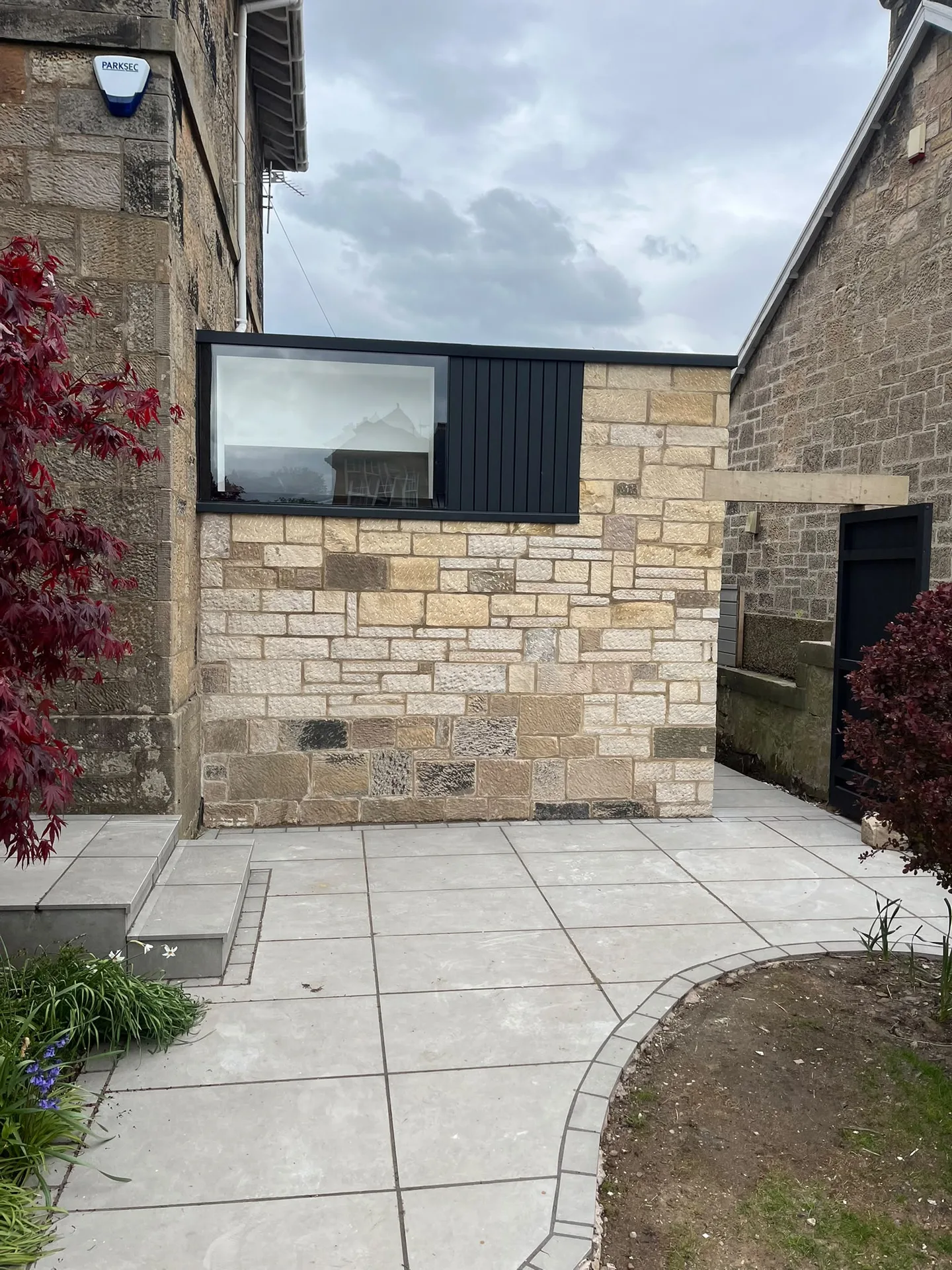 Modern courtyard renovation with restored stonework