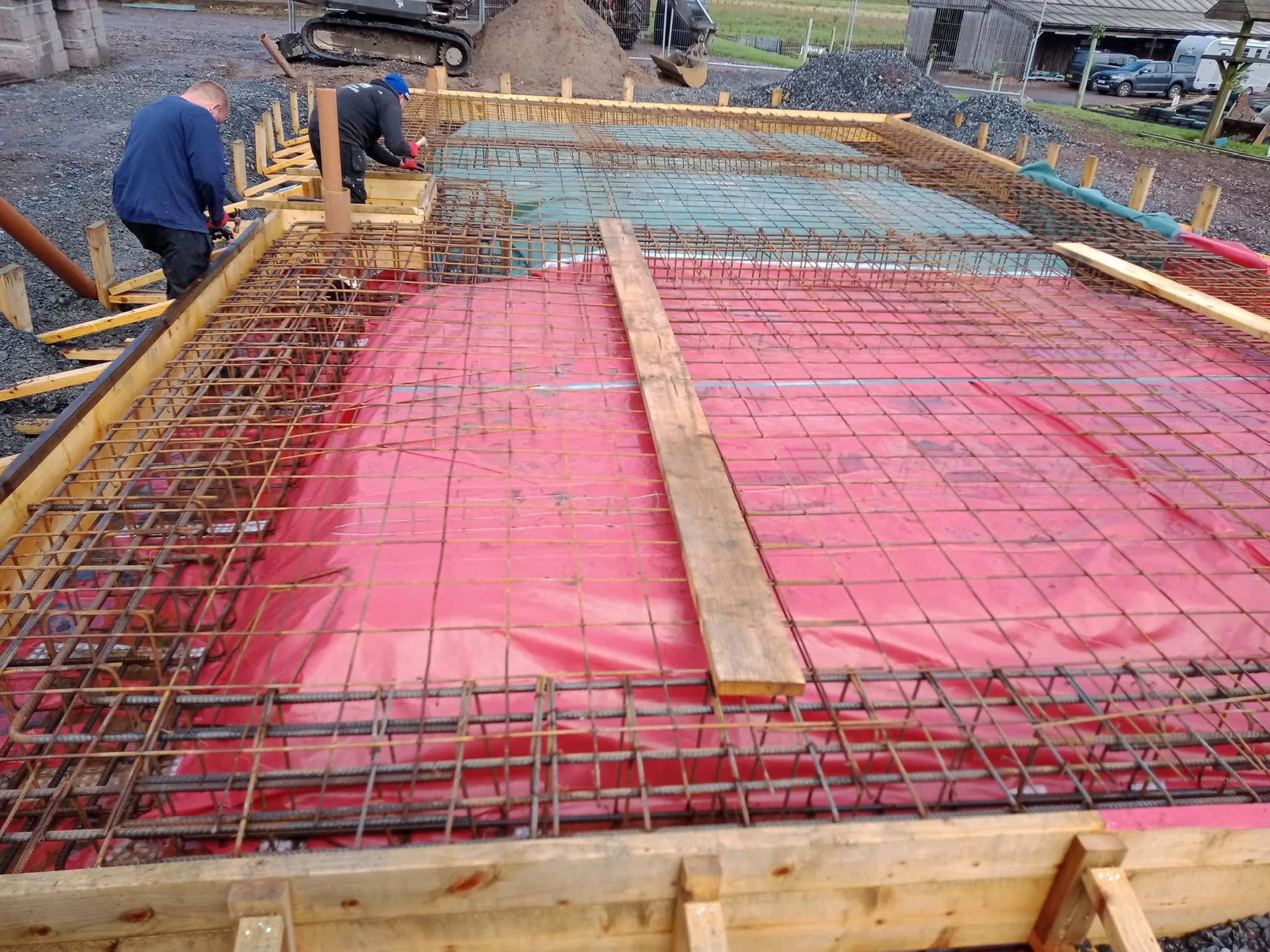 Foundation slab with protective mesh reinforcement during structural works on new build construction
